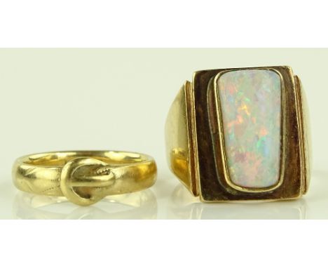 A large 9ct gold opal set panel ring, setting height 17.3mm, size N, and a 9ct buckle design band ring, size K, (2)