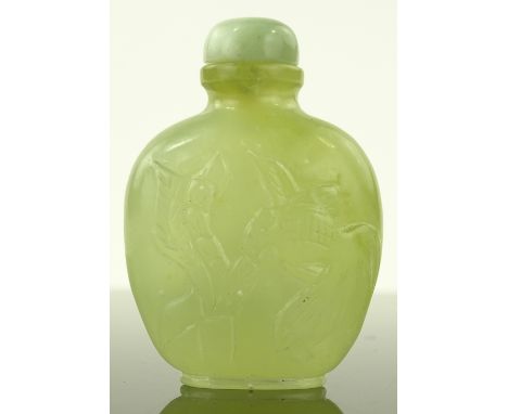 A Chinese relief carved jade snuff bottle with Koi carp designs, height 7cm