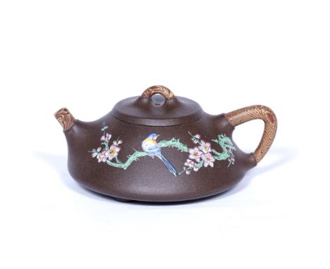 Yixing small teapot Chinese, 20th Century with polychrome enamels of blossom and a bird and with decor bois handles and spout