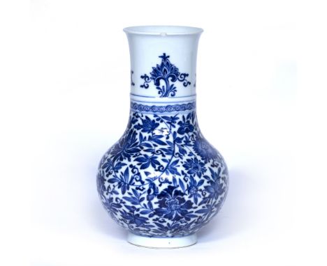 Transitional style blue and white pear shaped vase Chinese, 19th Century the globular body decorated with all over lotus and 