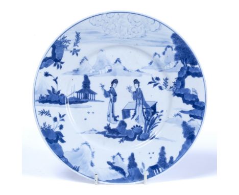 Blue and white plate Chinese, Kangxi (1662-1722) decorated with a garden scene set against a landscape of distant clouds, mou