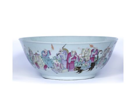 Porcelain large rounded bowl Chinese, 19th Century decorated in famille rose enamels with a hedge of foliage and rocks before