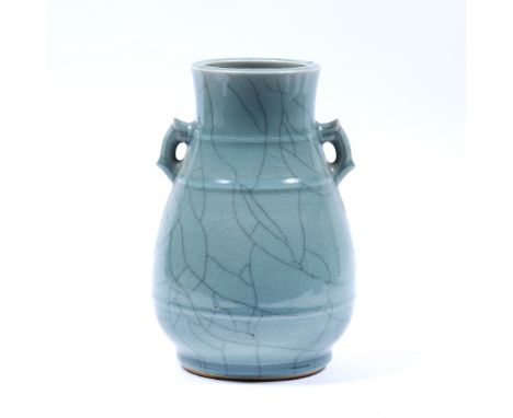 Celadon crackle glazed porcelain vase Chinese of bulbous form with twin handles, seal mark to base 23cm high 