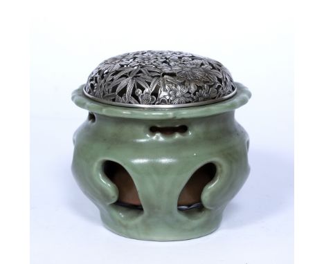 Celadon brush or flower container holder Chinese, 19th Century the rounded body with bracket shaped openings, the narrow wais