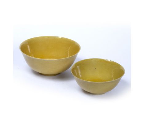 Two yellow ground bowls Chinese the first with incised dragons in flight with five claws above crashing waves, Kangxi Zhuansh