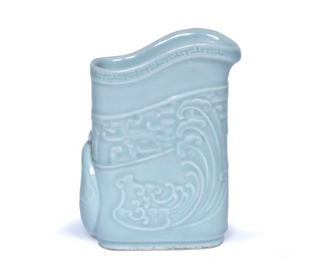 Celadon archaic style jug Chinese moulded wave design with stylised handle, seal mark to the base 13cm high