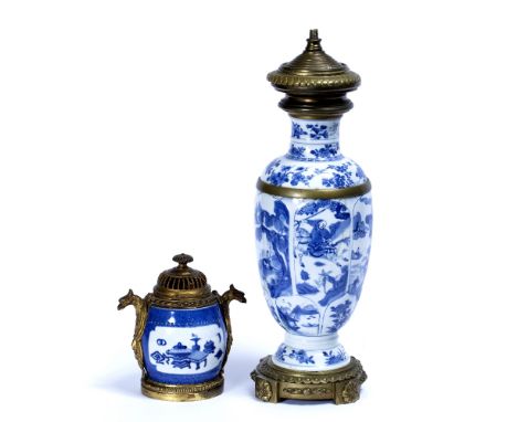 Two blue and white ormolu mounted vases Chinese, Kangxi (1662-1722) the largest decorated in panels depicting hunting scenes 