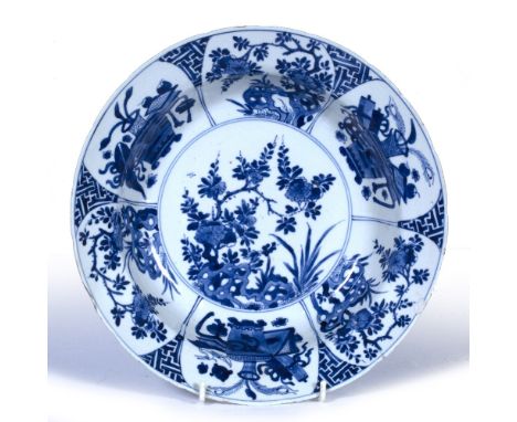 Blue and white bowl Chinese, Kangxi (1662-1722) decorated with a circular inner panel depicting flowers in a rocky outcrop su