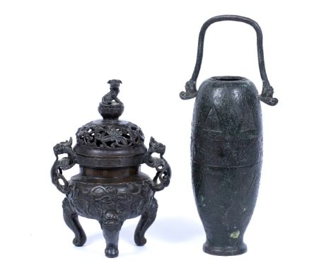 Two bronze vessels Chinese, 18th Century the first in the form of a vase with stylised flowers to the centre and engraved dec