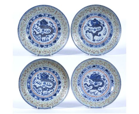 Blue and white dragon porcelain plates Chinese, 19th Century each with enamel polychrome border, Kangxi four character marks 