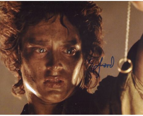 Lord of the Rings 8x10 photo signed by actor Elijah Wood as Frodo Baggins. Good condition. All autographs come with a Certifi