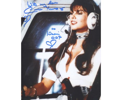 007 James Bond 8x10 The Spy Who Loved Me scene photo signed by Bond girl Caroline Munro. Good condition. All autographs come 