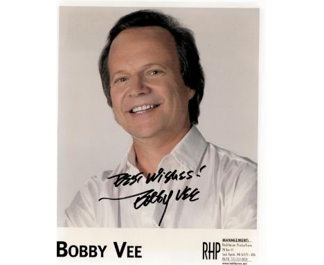 Bobby Vee Signed 10x8 Colour Photo. Vee, was an American singer, songwriter, and musician who was a teen idol in the early 19