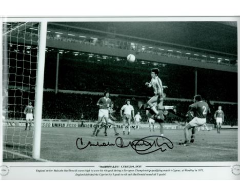 Football Malcom MacDonald signed 18x12 black and white print picture scoring his Fourth goal against Cyprus at Wembley in 197