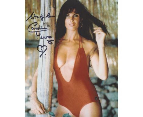 007 Bond girl Caroline Munro signed 8x10 The Spy Who Loved Me sexy swimsuit photo. Good condition. All autographs come with a