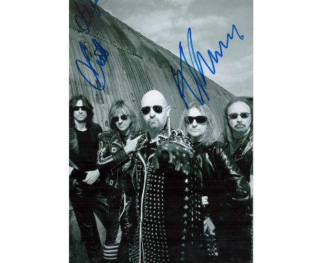 K. K. Downing and Scott Travis signed 12x8 black and white photo. 1 other signature From the band Judas Priest. Good conditio