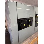Green Mist ex display kitchen comprising of three 600mm oven housings, and two 300mm larder units (