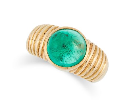 AN EMERALD DRESS RING in 18ct yellow gold, set with a central round cabochon emerald of 4.08 carats, on a pipe design shank, 