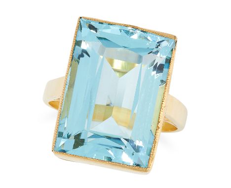A 15.6 CARAT AQUAMARINE RING set with a step cut aquamarine of 15.60 carats in a rub over setting, size N / 6.5, 8.72g.