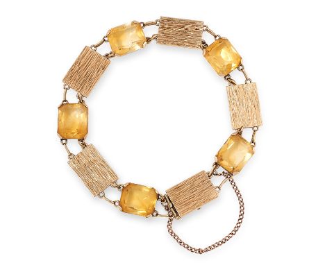 A CITRINE BRACELET in yellow gold, set with mixed step cut citrines and textured gold plaque spacers, 19cm, 16.5g. 