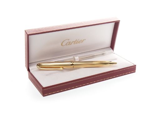 CARTIER GOLD PLATED RETRACTABLE BALLPOINT PEN, with linear striations to the whole case, engraved Cartier Paris to the lid ed