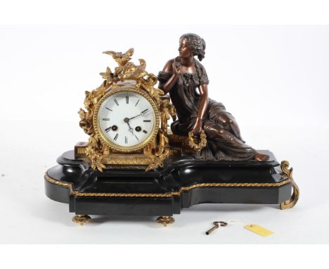 A French bronze and gilt metal mounted mantel clock, the 3 1/4" enamelled dial on a brass eight day movement striking to a be