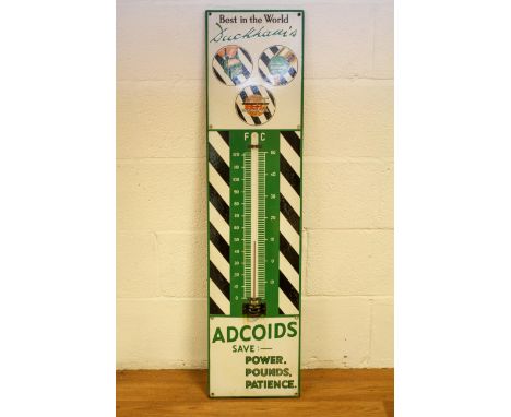 A Duckhams Adcoids enamel advertising thermometer, in black, white and green, 116cm high