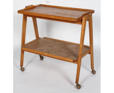 A Remploy mid 20th Century vintage golden oak two tier drinks trolley having a detachable tray tier to top, all raised on 'A'