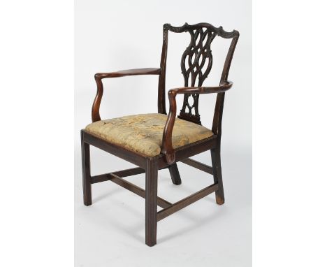 A mahogany George III 'Chippendale' armchair, with upholstered drop-in seat on square reeded legs, 94cm high