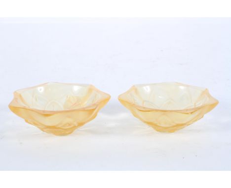 A pair of Lalique pale orange pressed glass dishes, of flower head form, etched mark to underside of each "Lalique, R, France
