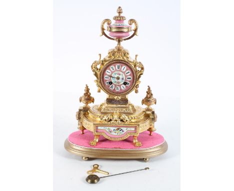 A French gilt metal mantel clock, the Sevres style rose pomadour dial on a brass eight day movement striking to a bell, the c