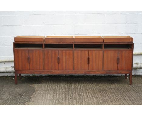 Robert Heritage for Archie Shine, a mid-century teak sideboard, with four drawers above four pairs of cupboard doors enclosin