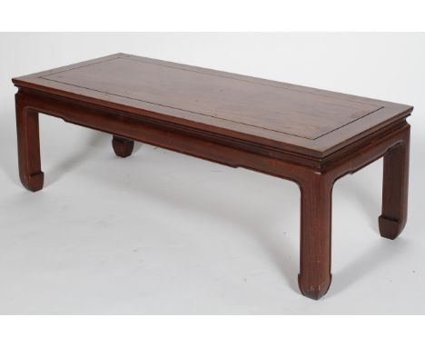 A Chinese hardwood low table, late 19th/early 20th century, the rectangular top on slightly shaped apron and legs, 40cm high 