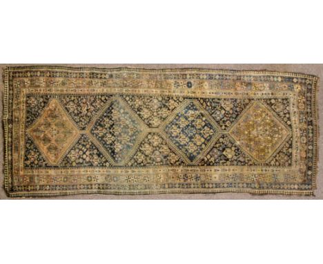 A Kurdish runner, North West Iran, with four lozenges, 275cm x 110cm approx