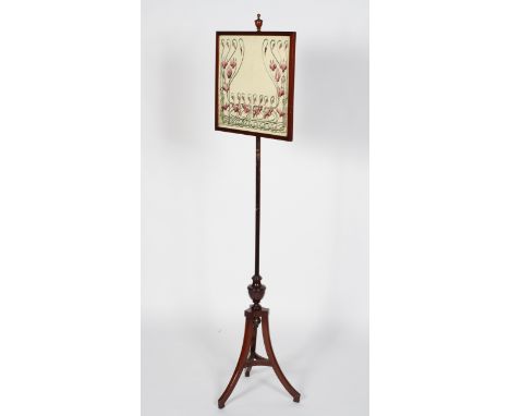 A Victorian mahogany adjustable fire screen, the rectangular screen with Art nouveau style silk work floral panel on a column