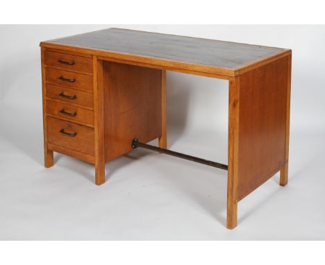 A 20th century vintage golden oak pedestal desk having a single bank of five drawers with metal handles, all raised on square