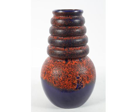 A large 1960's vintage West German floor vase, having a tapering ribbed form in deep purple and orange fat lava glaze, model 