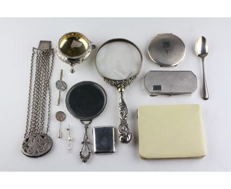 A collection of silver and white metal items, to include two engine turned powder compacts, a magnifying glass, cauldron salt