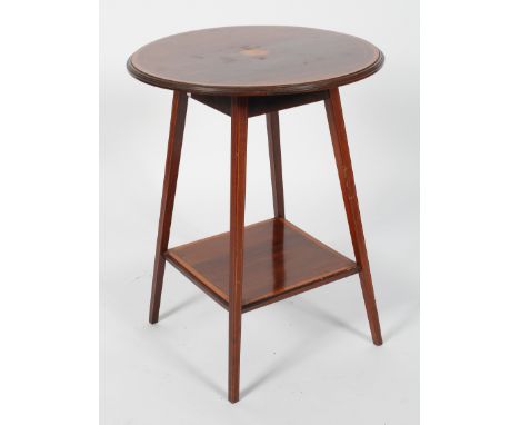 An Edwardian mahogany and satinwood inlaid circular occasional table, with a central patera, on four square section legs and 