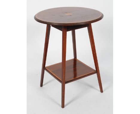 An Edwardian mahogany and satinwood inlaid circular occasional table, with a central patera, on four square section legs and 