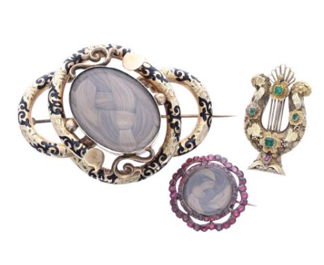 Victorian gold and enamel open scroll mourning brooch, with an oval hair locket panel and inscribed and dated verso '16th Apr