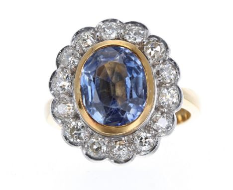 Good large 18k sapphire and diamond oval cluster ring, the oval sapphire estimated 2.50ct approx, in a white metal surround o