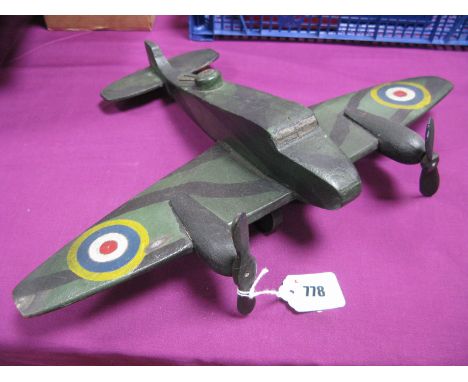 A Mid XX Century Wooden Home Crafted 'Toy' Aircraft, in the form of an RAF two engine bomber.