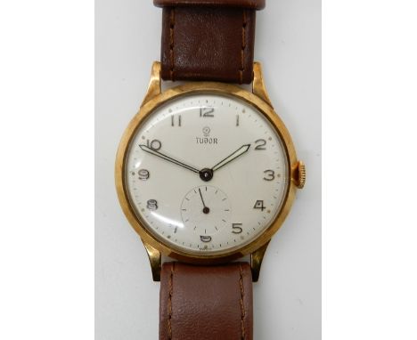 A 9CT GOLD GENTS TUDOR WRISTWATCH cream dial with black Arabic numerals, subsidiary seconds dial and luminous hands. 9ct case