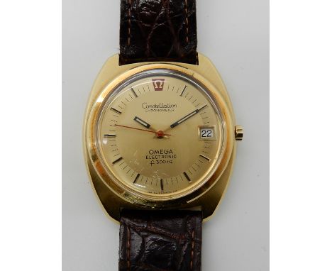 AN 18CT GOLD OMEGA CONSTELLATION CHRONOMETER F300HZ ELECTRONIC a retro two tone gold coloured dial, with gold coloured baton 