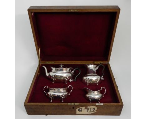 AN EDWARDIAN SILVER FOUR PIECE TEA SERVICE by George Edward &amp; Sons, London 1906, of rounded oval form with scalloped bord