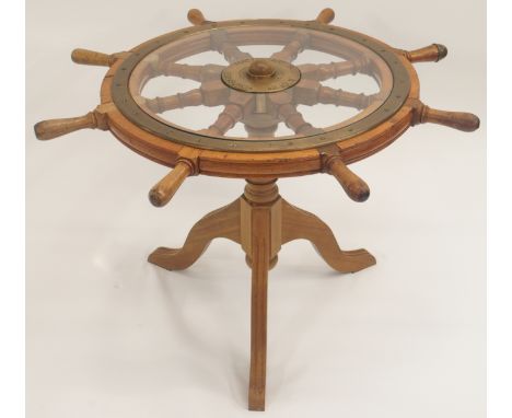 AN OAK AND BRASS MOUNTED SHIPS TELEMOTOR WHEEL WITH EIGHT SPINDLES the brass plate named MacTaggart Scott &amp; Co Limited, E