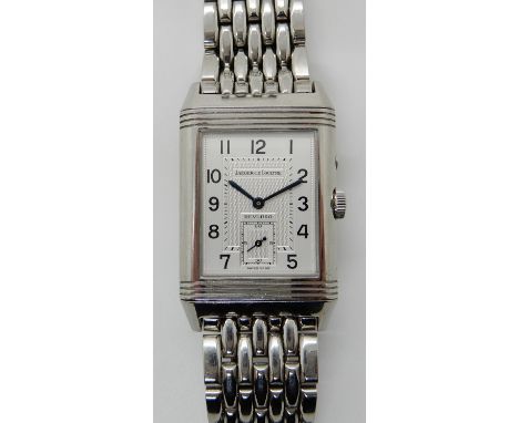 A STAINLESS STEEL JAEGER LE COULTRE NIGHT & DAY REVERSO WATCH with a white 'day' metallic dial with engine turned detail, blu