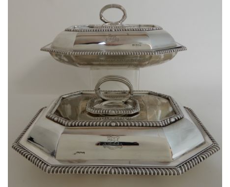 A PAIR OF LATE VICTORIAN ENTREE DISHES AND COVERS by Harrison Brothers &amp; Howson, of elongated octagonal shape with gadroo