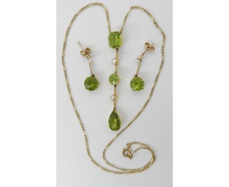 A 9CT GOLD PERIDOT AND PEARL NECKLACE WITH MATCHING EARRINGS the pendant set with step cut, pear cut and round peridots inter